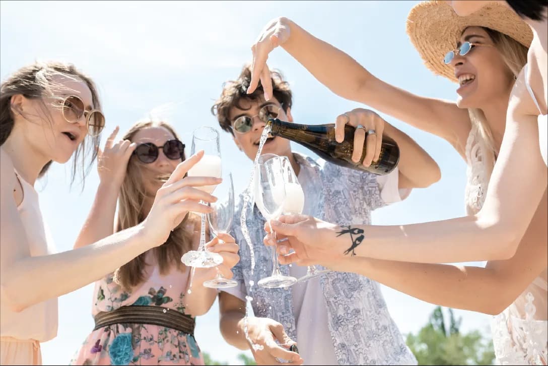 Friends celebrating at the beach club